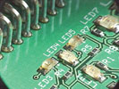 Figure 7. Bottom sided images of chip resistors and BGA terminations and a top sided view featuring successful reflow of LED and intrusive reflow connector joints